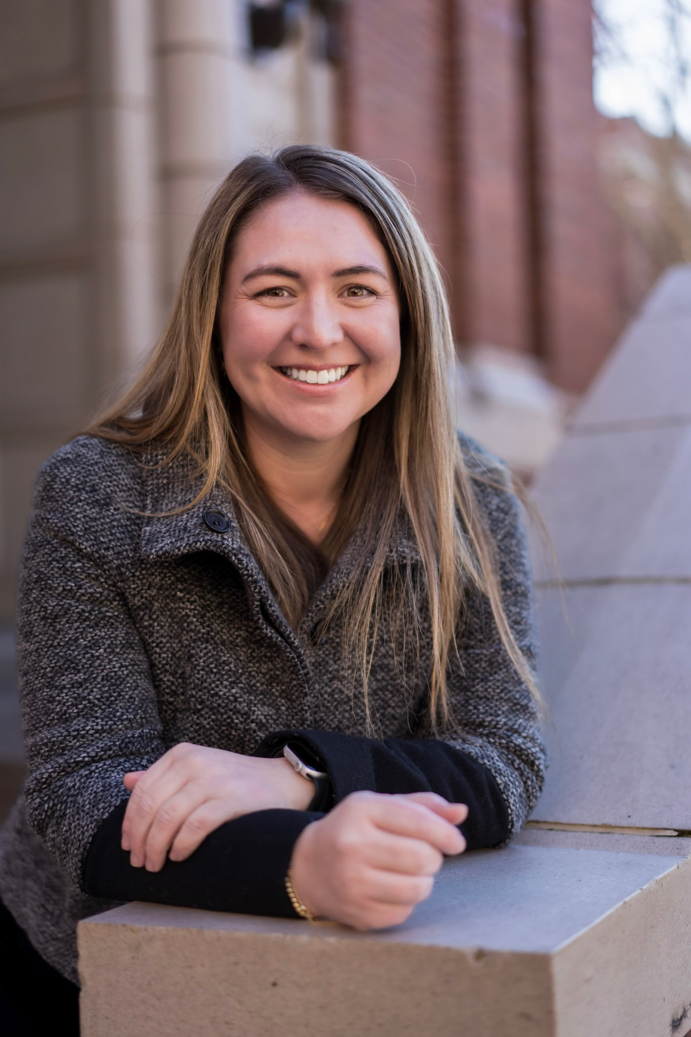 Heather Gabbert smiling in a warm outdoor portrait.